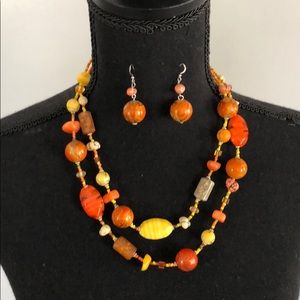 Orange beaded necklace with matching earrings